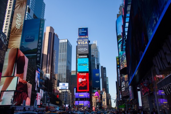 Colorful billboards and crowds in Times Square, New York City – a must-see destination for first-time visitors