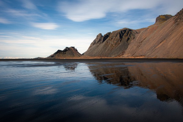 Vestrahorn mountain in Iceland - mirror like reflection in the water